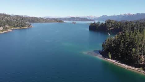 stunning aerial: beautiful clear blue nahuel huapi lake in patagonia