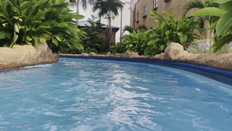 POV-along-lazy-river-during-a-bright-day