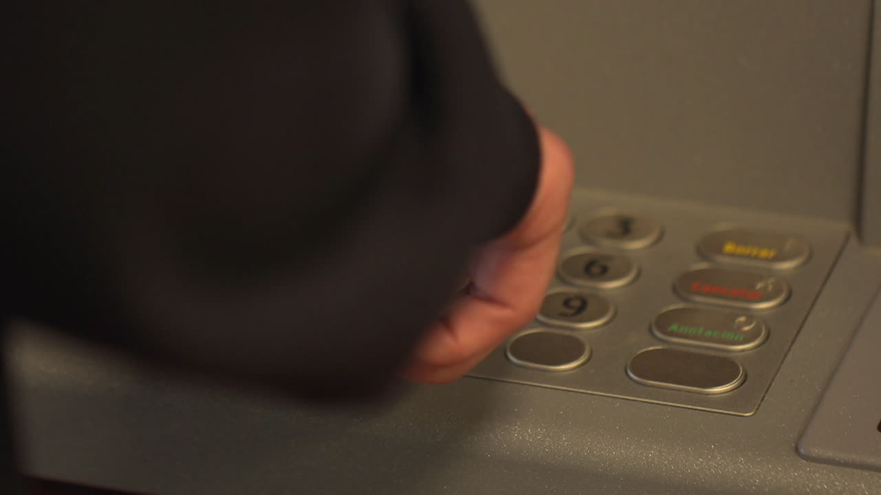 Person using ATM machine