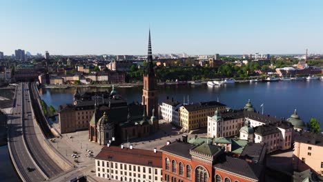 orbiting aerial view above riddarholmen cathedral in stockholm, sweden