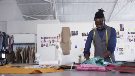 mixed race man working in fashion office