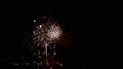 Real-fireworks-exploding-celebration-frame-fill-and-loop-seamlessly-abstract-blur-bokeh-lights-in-the-night-sky-with-the-glowing-fireworks-show-festival