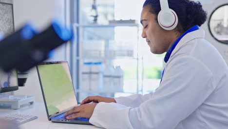 science, laptop and man with headphones