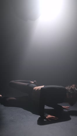 woman practicing yoga poses in a studio setting