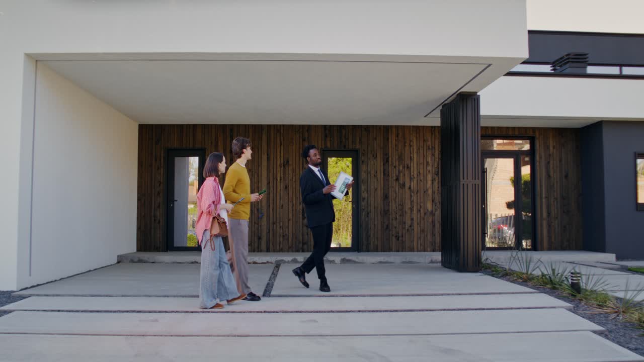 Real Estate Agent Showing a Modern Home