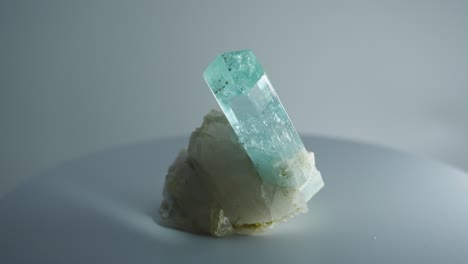 light blue hexagonal crystal rotating