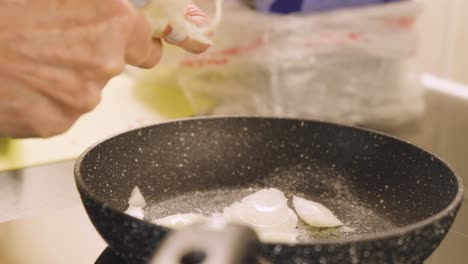 home cooking - chopping onions over a frying pan