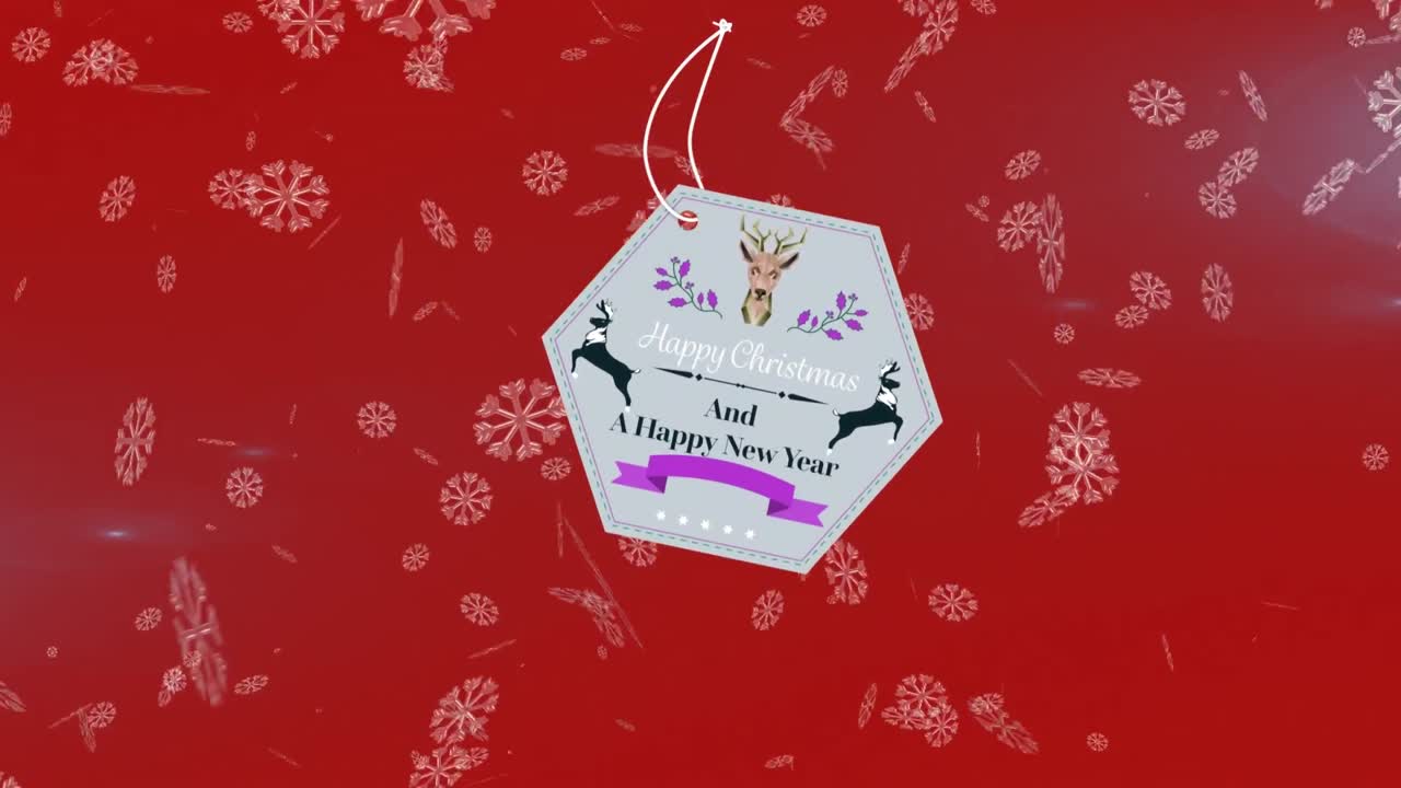 animación del texto de navidad sobre copos de nieve que caen sobre un fondo rojo