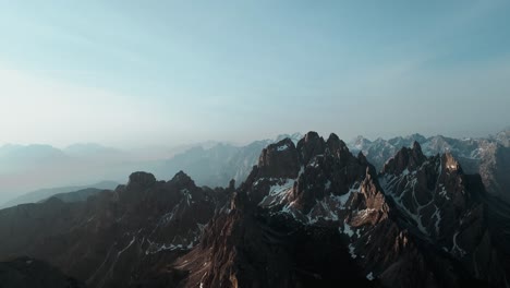 Beautiful-aerial-alpine-mountain-range-landscape,-snow-covered-peaks,-south-tyrol