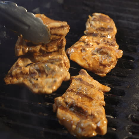 preparation of delicious succulent meat steaks on the grill. barbecue from charcoal. sqare video