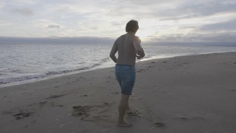 Dancer-jump-on-beach-during-sunrise