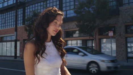 stylish woman watching urban architecture on walk. asian girl walk city street.