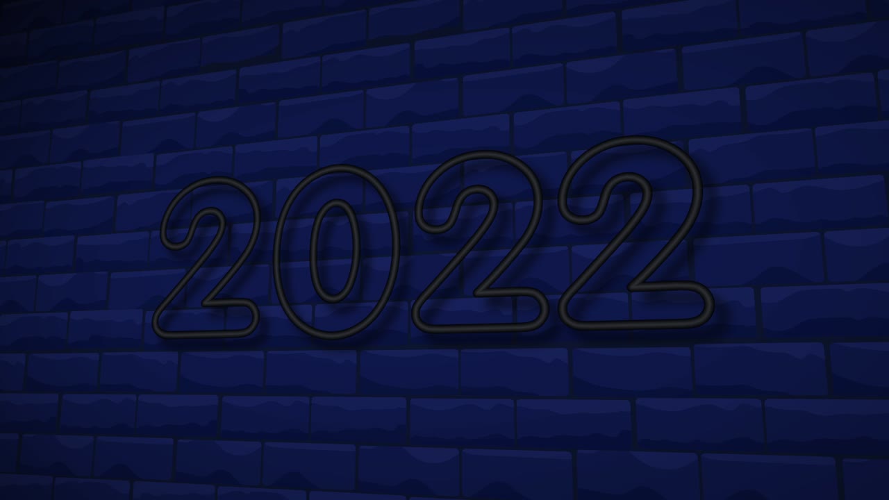 signo de neón 2022 en el fondo de la pared de ladrillo.