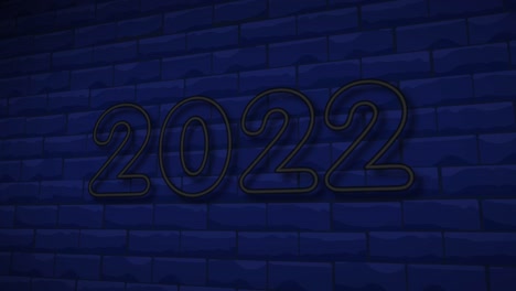 signo de neón 2022 en el fondo de la pared de ladrillo.
