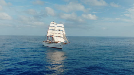 sea cloud sailing cruise ship vessel with passengers on board in the atlantic ocean, drone shot