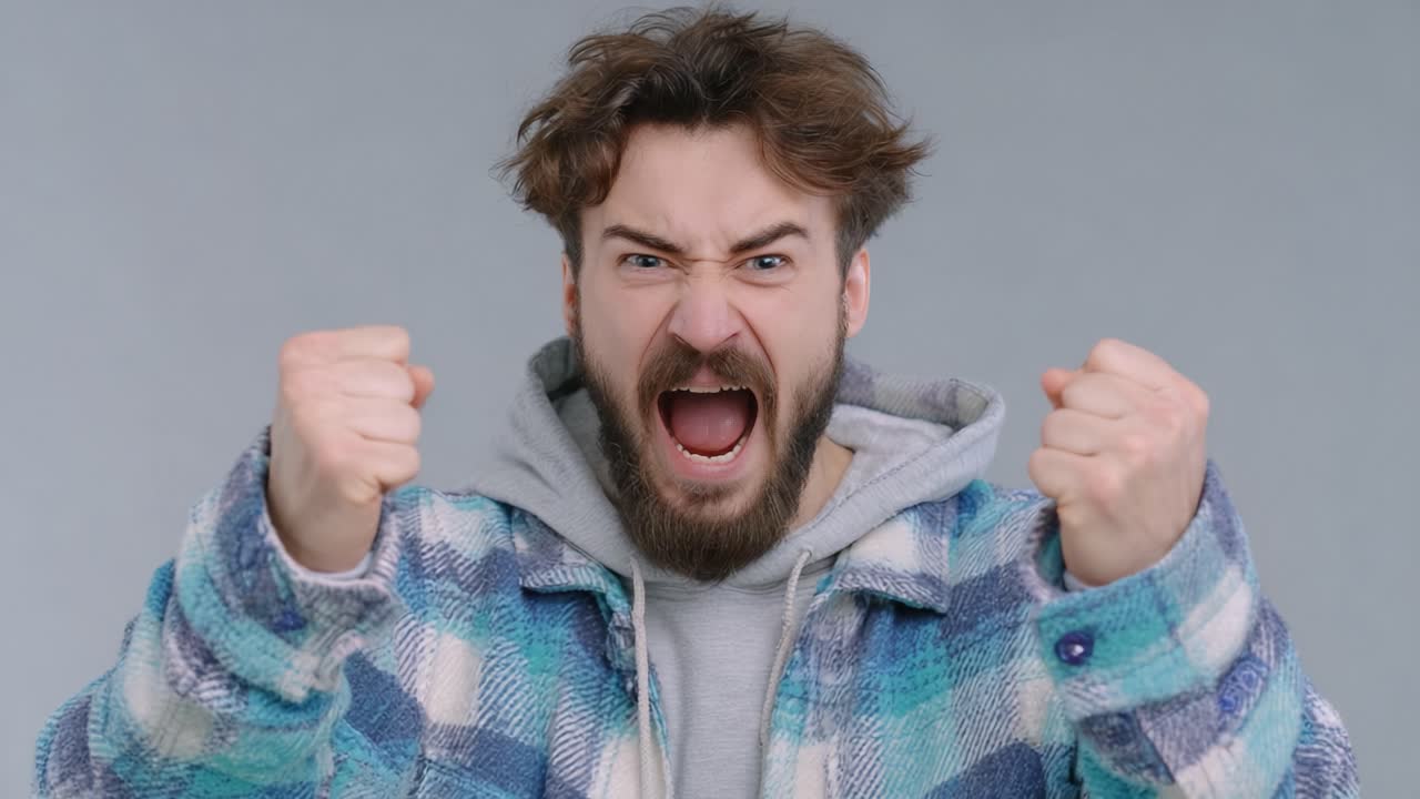 Astonishing Transformation: From Rage to Joy - Capturing the Emotional Journey of a Young Man Displaying Raw Anger Evolving into Pure Excitement