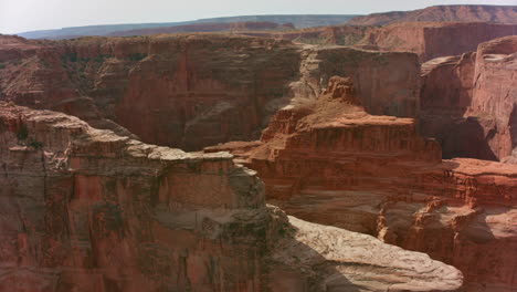 vast reddish-brown canyon landscape with intricate rock formations