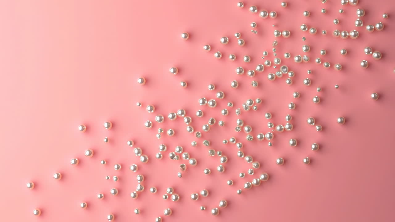 Scattered White Pearls on a Soft Pink Background