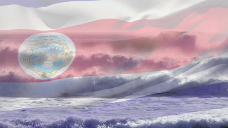 composición digital de ondear la bandera de costa rica contra las olas en el mar