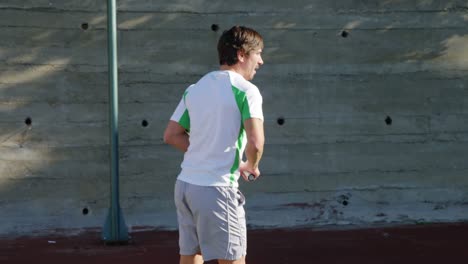 active man playing tennis