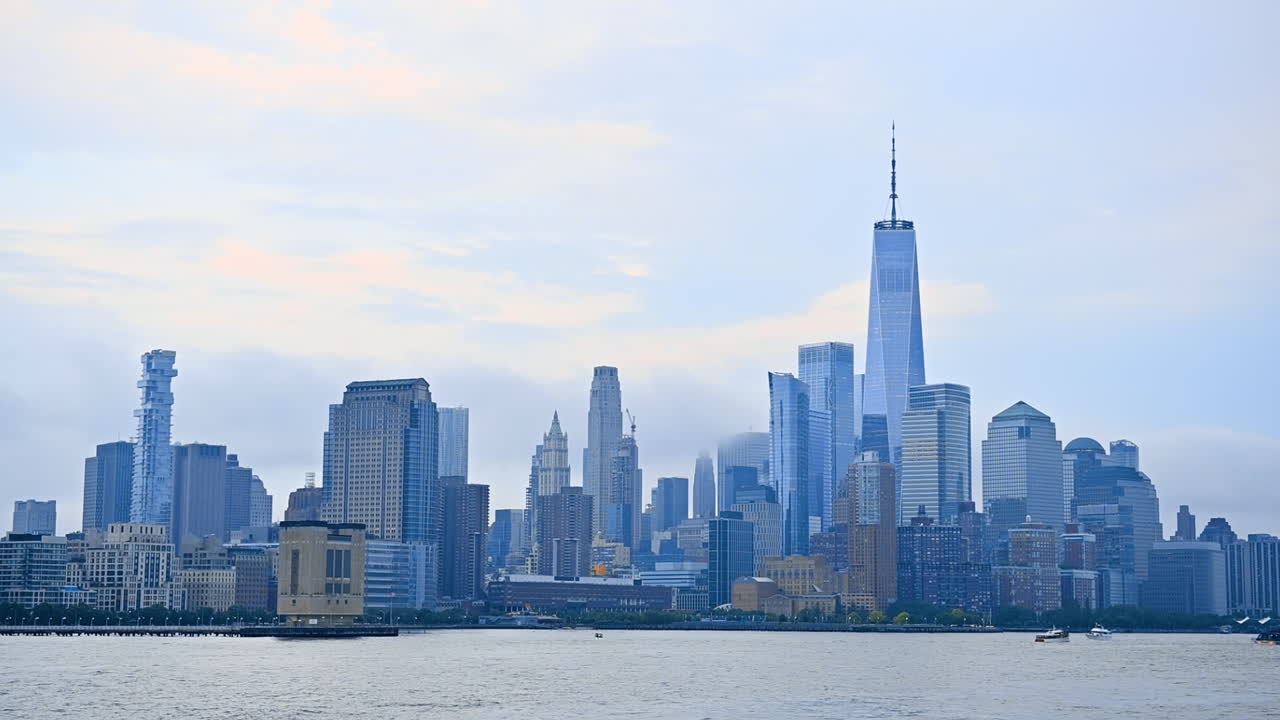 Hazy skyline of modern New York, USA. View on the lower Manhattan architecture from the river