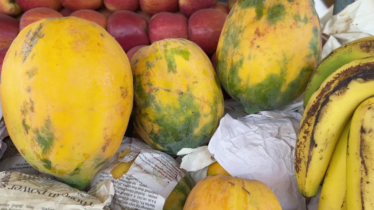 Fresh and Ripe papaya for sale at the fruit stall, tracking shot of papaya at the fruit shop