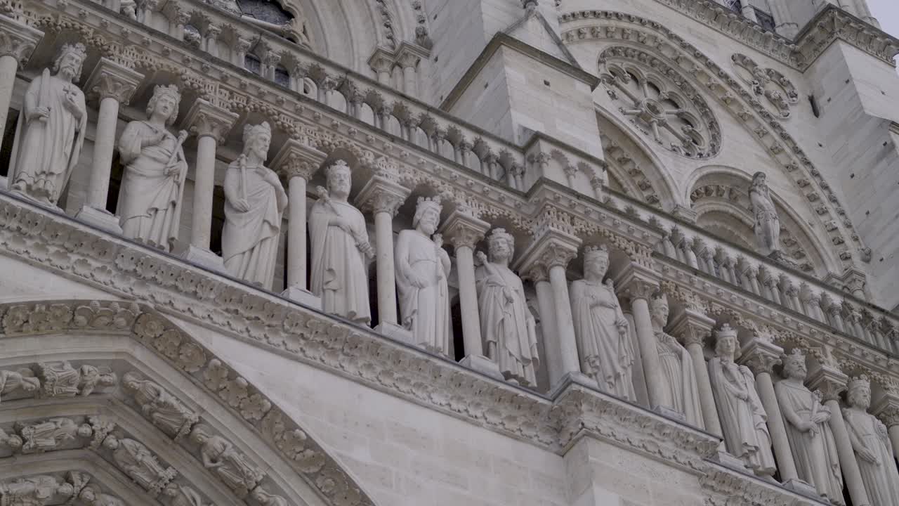 Detailed sculptures on the Notre Dame Cathedral in Paris, France, showcasing intricate stonework
