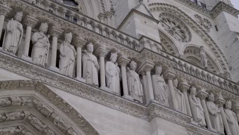 detailed sculptures on the notre dame cathedral in paris, france, showcasing intricate stonework