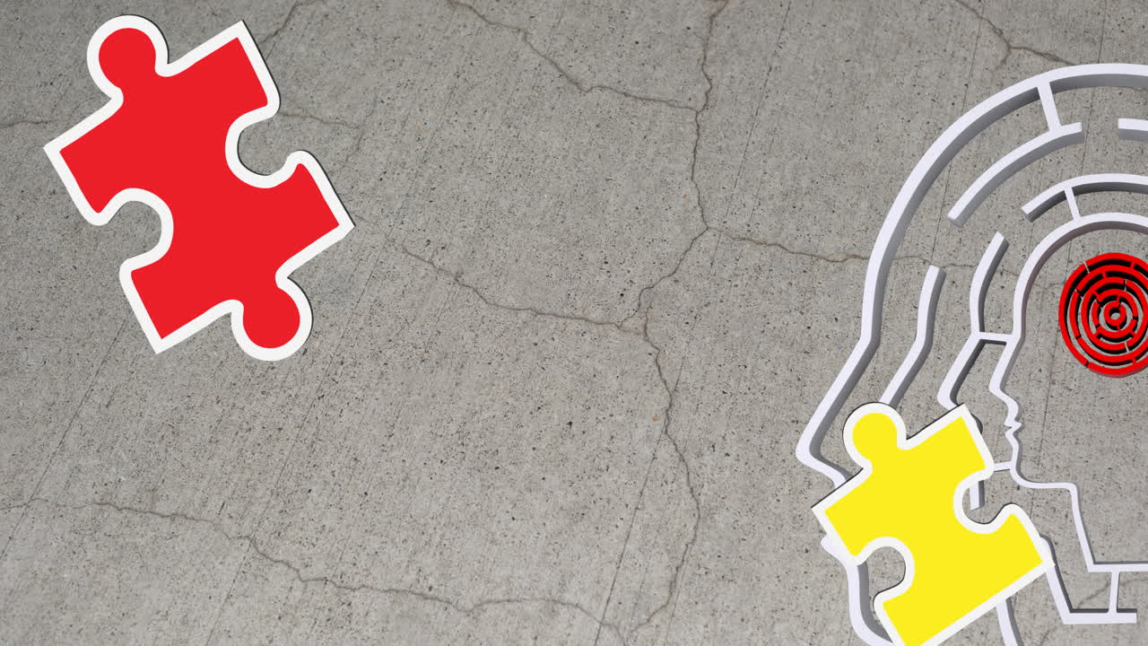 animación de piezas de rompecabezas verdes, amarillas y rojas que caen sobre el modelo de cabeza humana con laberinto