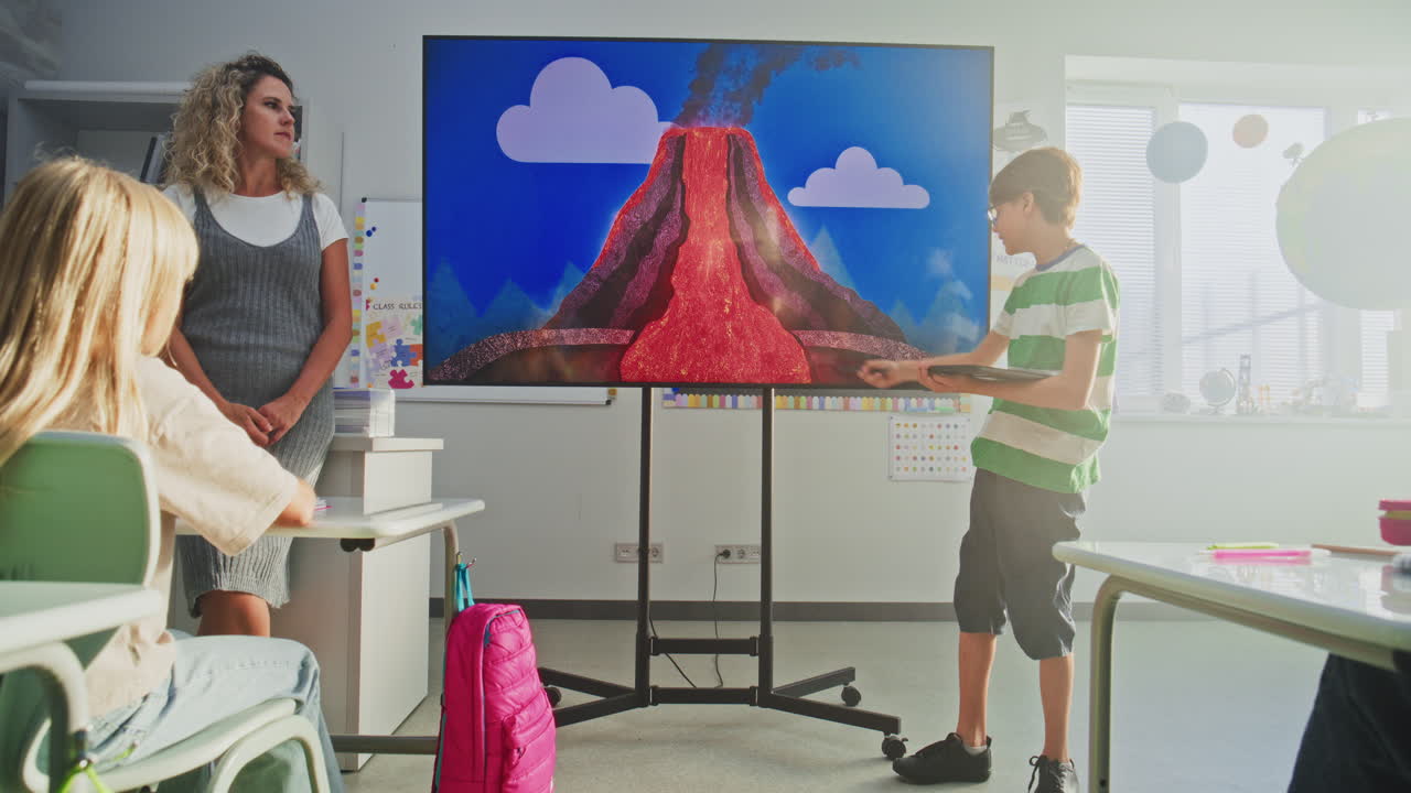 Elementary School Boy Giving Presentation About Solar System and Planets Using Digital Screen
