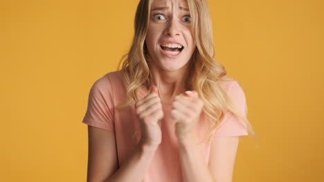 Nervous-Caucasian-woman-receiving-negative-news-on-camera.