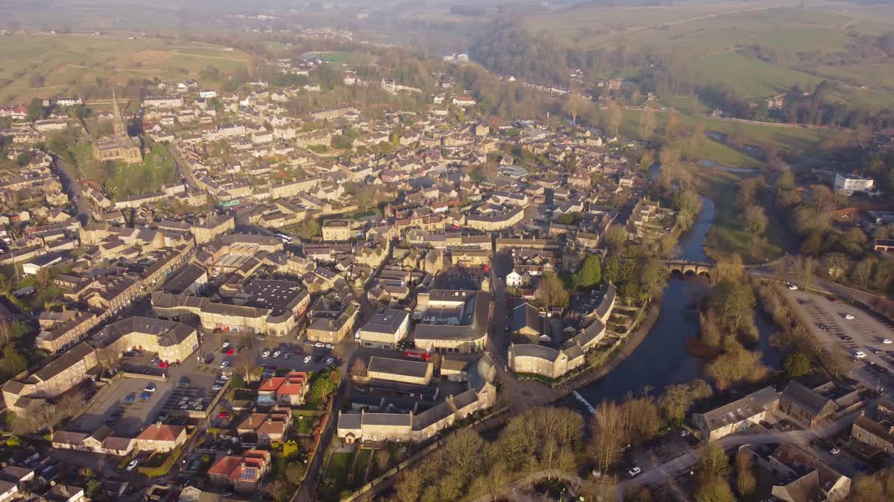Drone perspective over Bakewell Town with River Wye on a foggy morning in Derbyshire, Peak District - UK