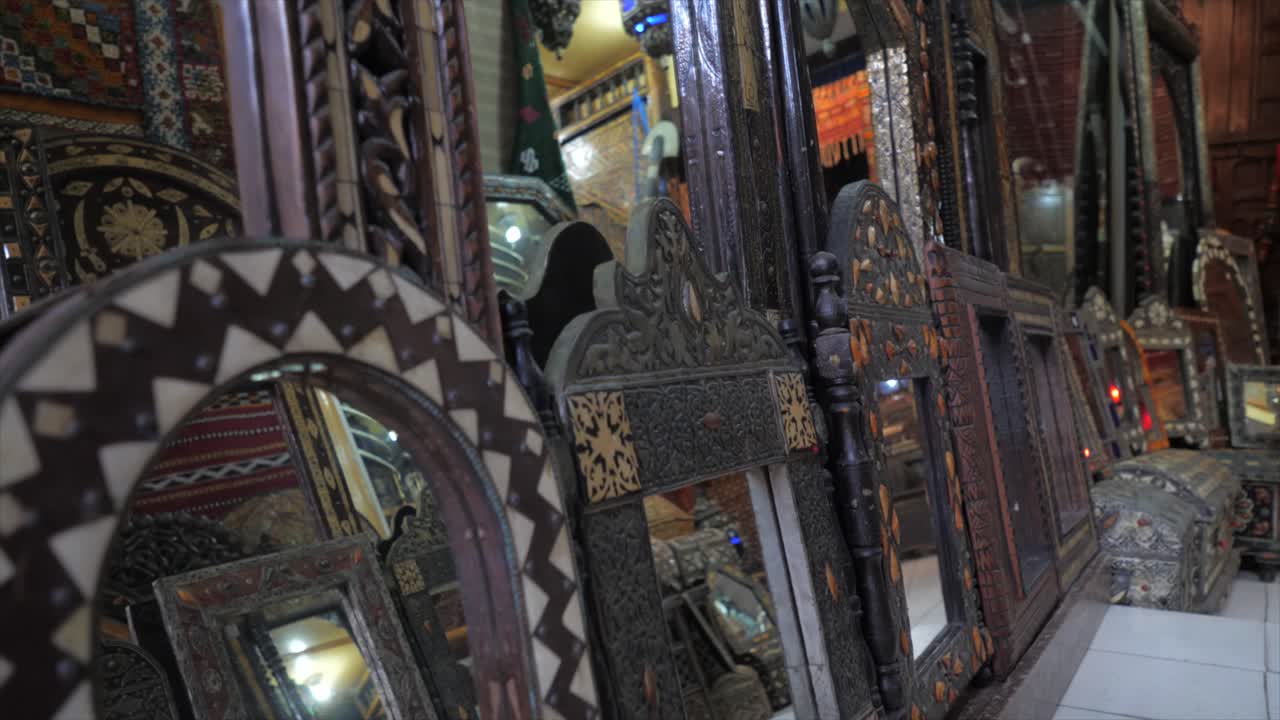Old antique close up of decorative mirrors in Moroccans art. Carved plaster Arabesques, zellige tilework, carved wood