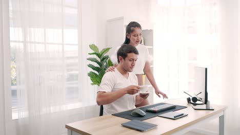 young man engineering and woman at a desk in an office looking at documents construction drawing home inspection with computer about working from home.