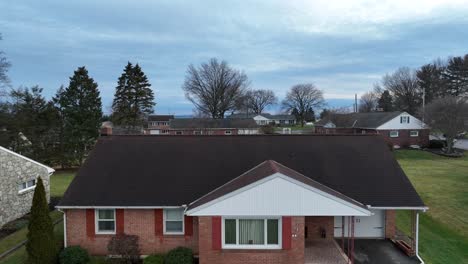 rise drone shot of american neighborhood in scenic area in winter