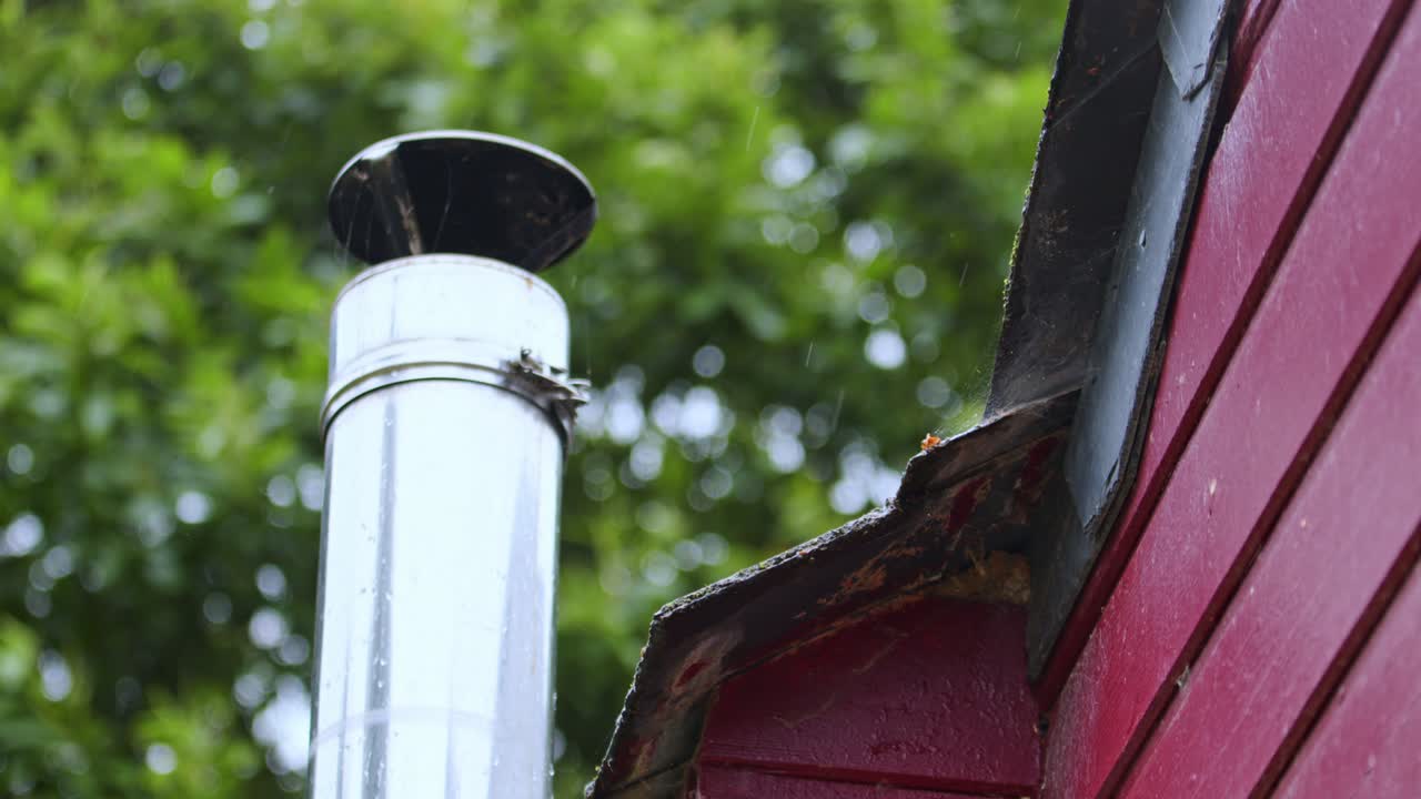 Steel Chimney Pipe On A Wooden Cottage In The Woods. Close-up Shot