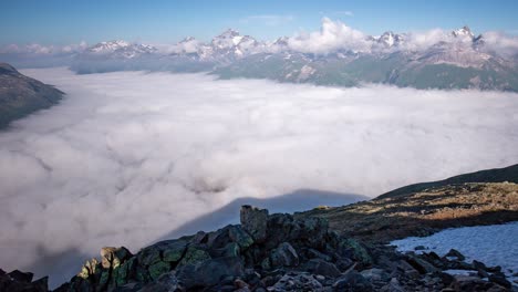 timelapse of a dynamic layer of morning fog moving in oberengadin valley seen from segantini hut above pontresina in directon of maloja pass