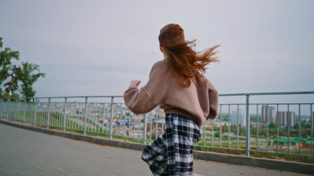 Girl Running with Wind in Cityscape