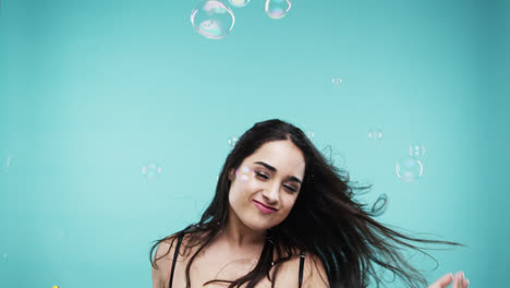 crazy face indian woman dancing in bubble shower slow motion photo booth blue background