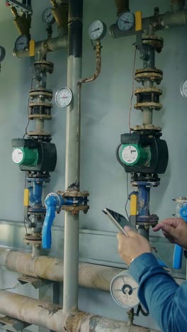 industrial technician inspecting piping systems