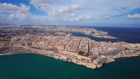 beautiful dramatic drone landscape of valletta city on warm sunny day