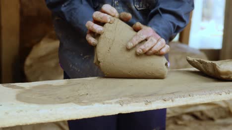 Knead-grinding-clay-dough-for-pottery-wheel-session