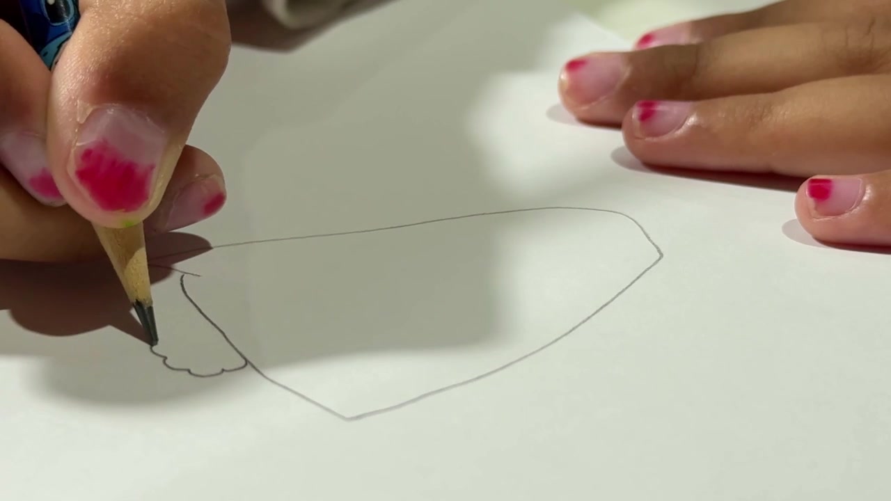 fingers holding pencil sketching shapes, children's art activity, creativity and drawing practice concept.