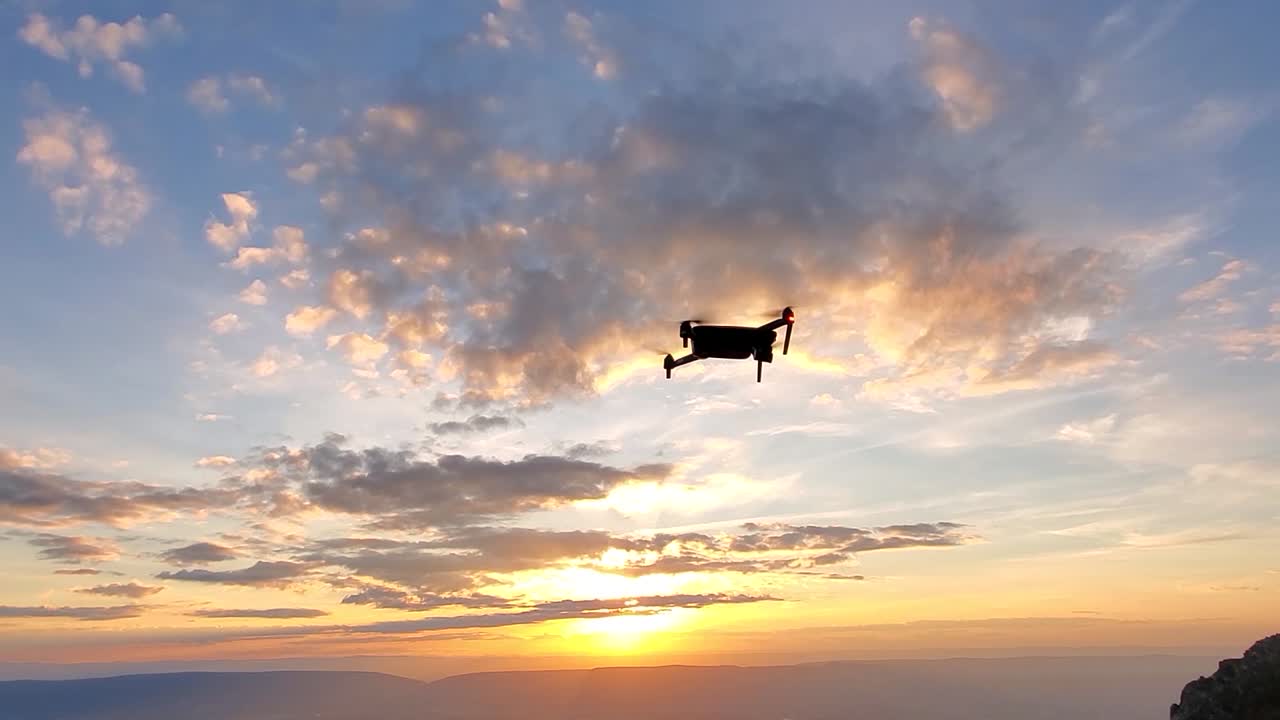 Drone flying on top of mountain stock
