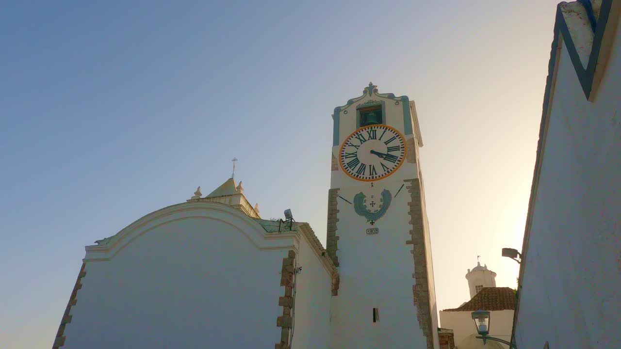 The last rays of spring sun on Santa Maria Church Tavira Algarve Portugal