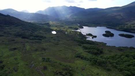 beautiful landscape of ladies view with sun rays reflecting on lakes in killarney national park