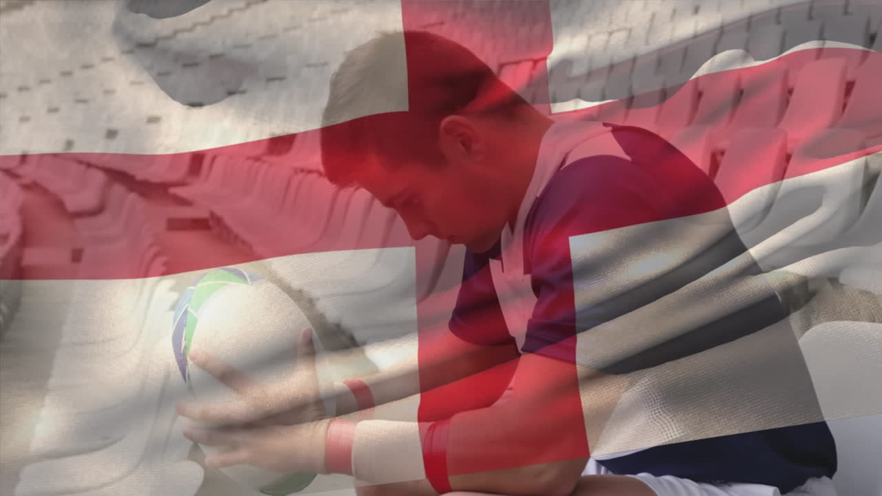 Animation of england flag over caucasian male player with rugby ball thinking and sitting in stadium