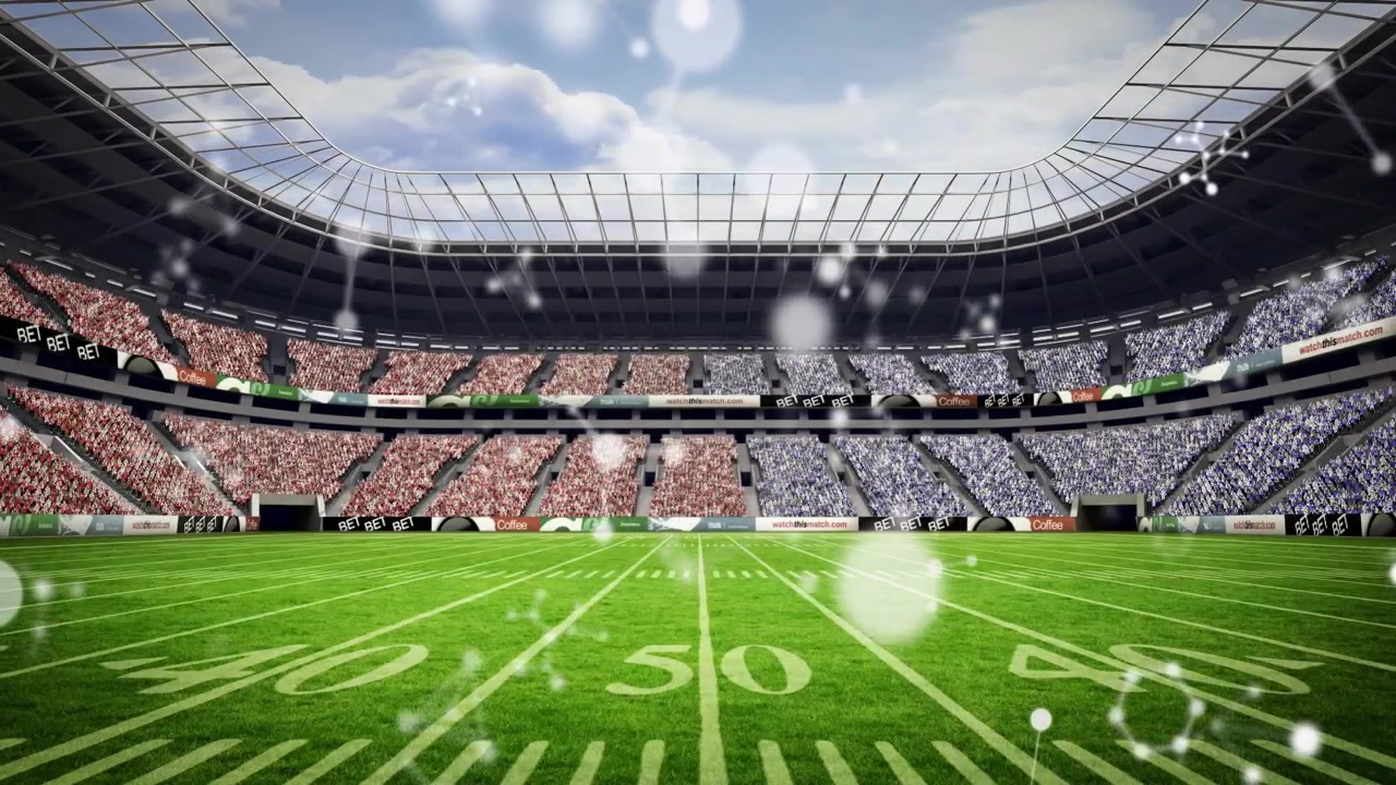 Sfere molecolari bianche che fluttuano su un tappeto erboso da 50 iarde, seguendo un'apertura per la vista dello stadio