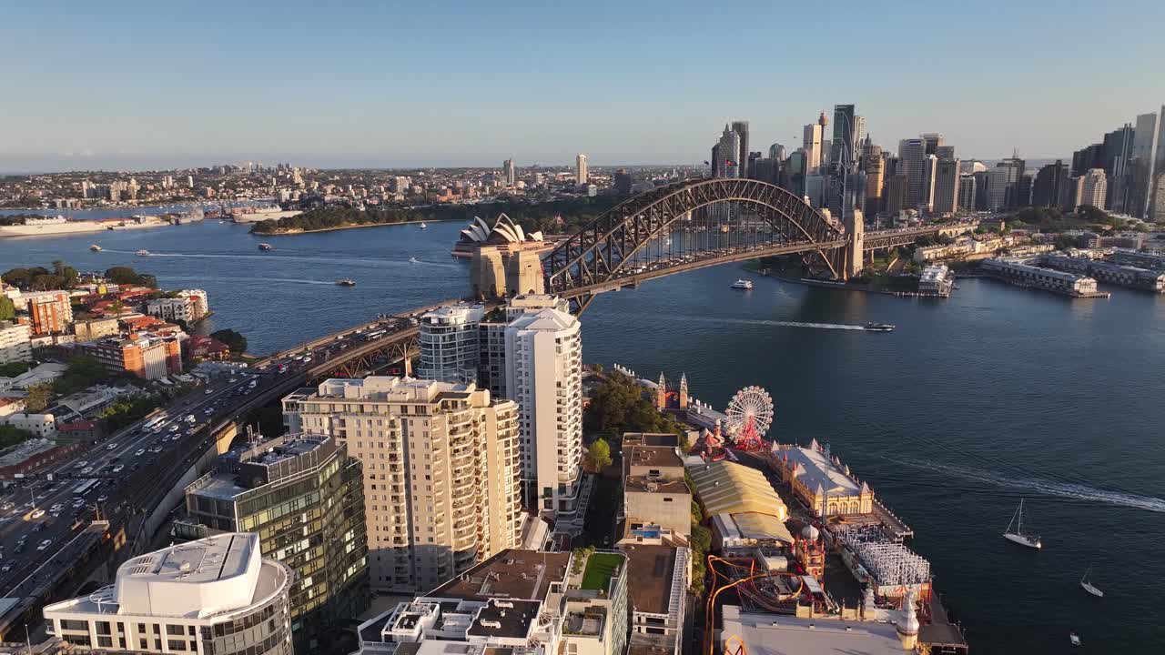 Drone pull back over North Sydney revealing famous attractions and Harbour Bridge. Cityscape
