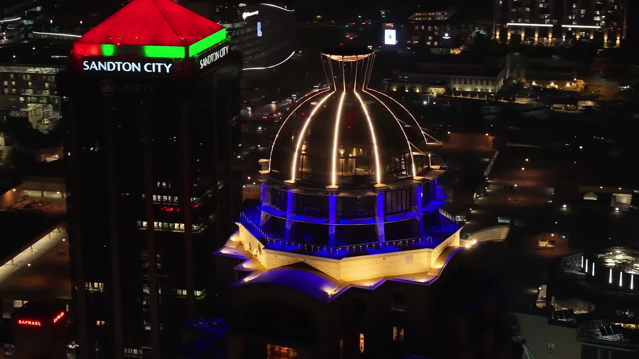 Vibrant Night Views of Sandton City Buildings and Skyline